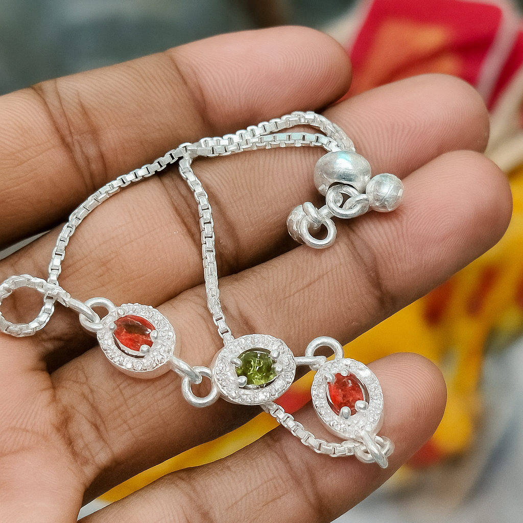 Elegant Silver Adjustable Bracelet with Red & Green Gemstones